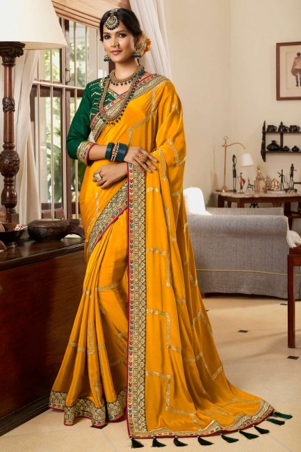 Saree in Yellow Crepe and silk with Lace