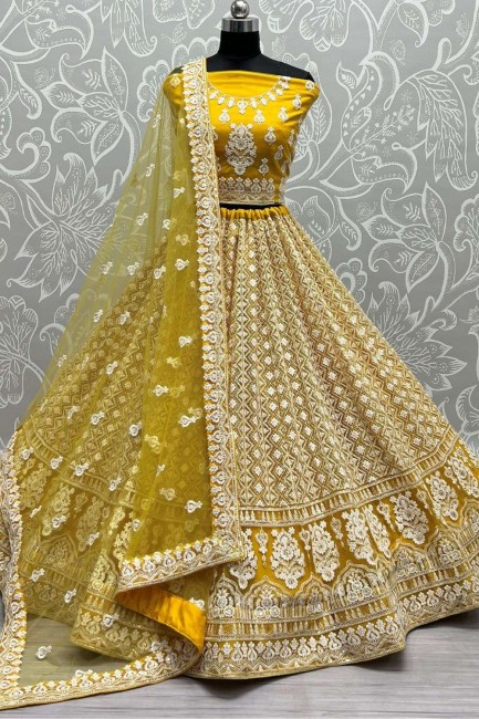 Yellow Bridal Lehenga Choli in Embroidered Net