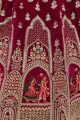 Embroidered Velvet Bridal Lehenga Choli in Rani  with Dupatta