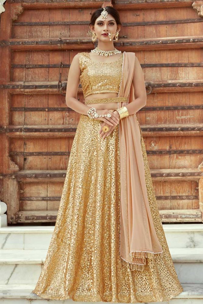 Golden color Net Lehenga Choli Online Designer Lehenga Choli with Light Peach Dupatta in India